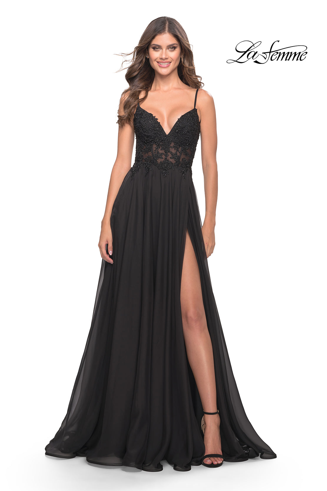 A woman poses against a white background in a La Femme Long A-Line Prom Dress featuring a sheer bodice.